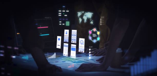 Close up ux developer and ui designer use augmented reality app brainstorming about mobile interface wireframe design on desk at night in office.Creative digital development agency